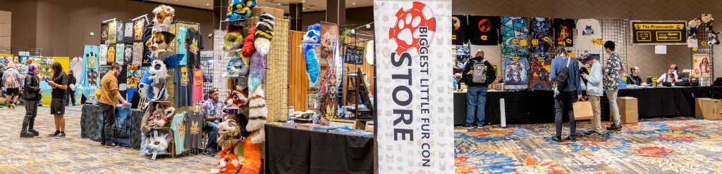 Dealers Den at Biggest Little Fur Con, with vendor stalls and attendees browsing merchandise