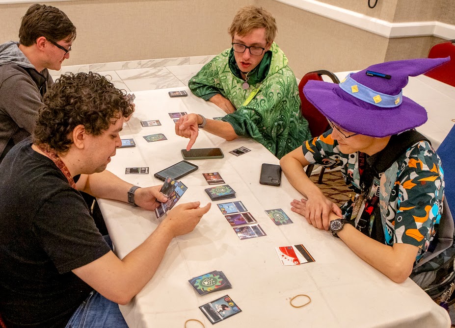 Attendees playing a card game